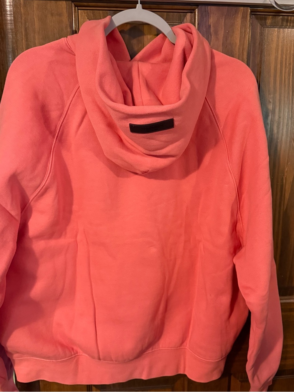 Essentials Coral-Orange Logo Pullover - Picture 2 of 6